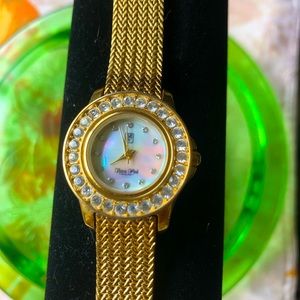 Victoria Wieck Crystal Watch Gold ToneMother of pearl face. Needs battery good C